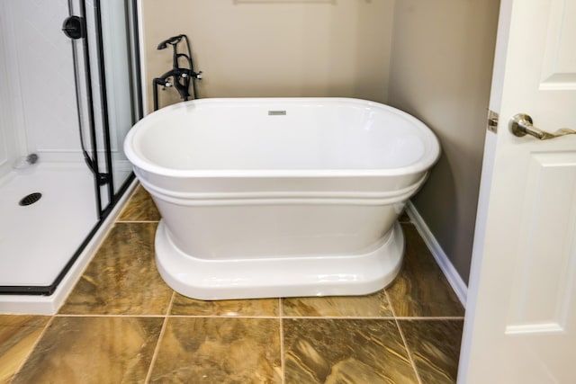 bathroom featuring a tub to relax in