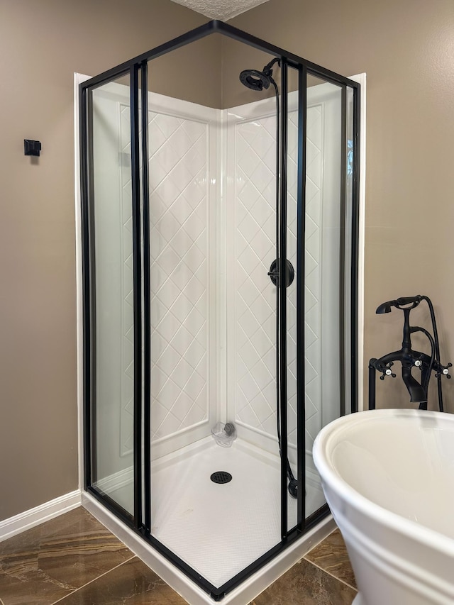 bathroom featuring a shower with shower door