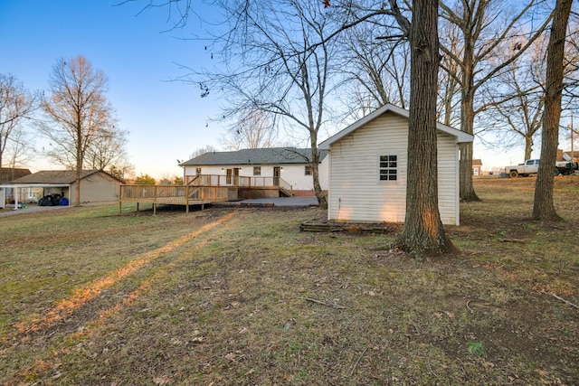 exterior space with a wooden deck and a yard