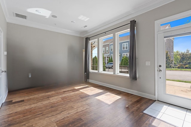 interior space featuring hardwood / wood-style flooring and crown molding