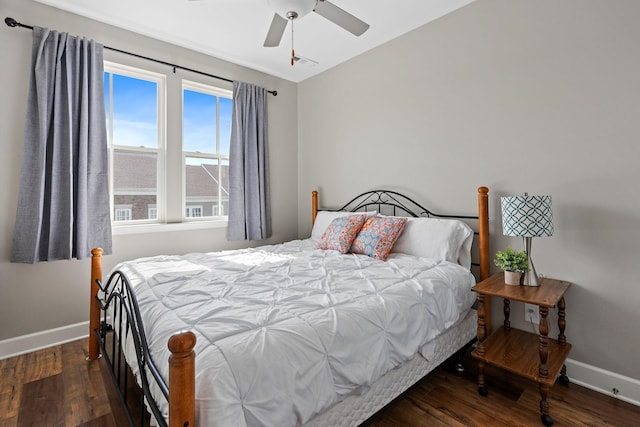 bedroom with dark wood-type flooring and ceiling fan