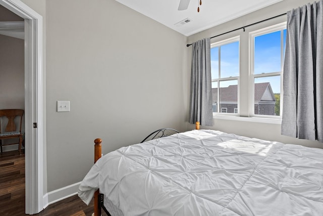 bedroom with dark wood-type flooring and ceiling fan