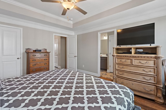 bedroom featuring crown molding, ceiling fan, connected bathroom, and dark wood-type flooring