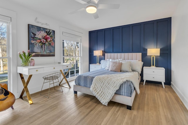 bedroom with ceiling fan and light hardwood / wood-style flooring