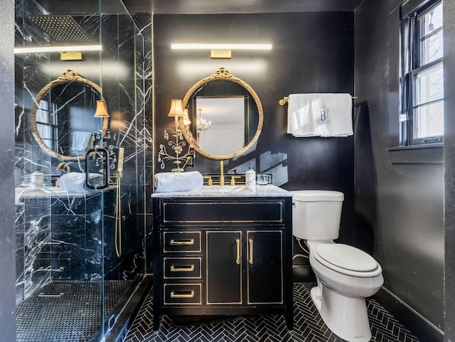 bathroom featuring walk in shower, vanity, and toilet