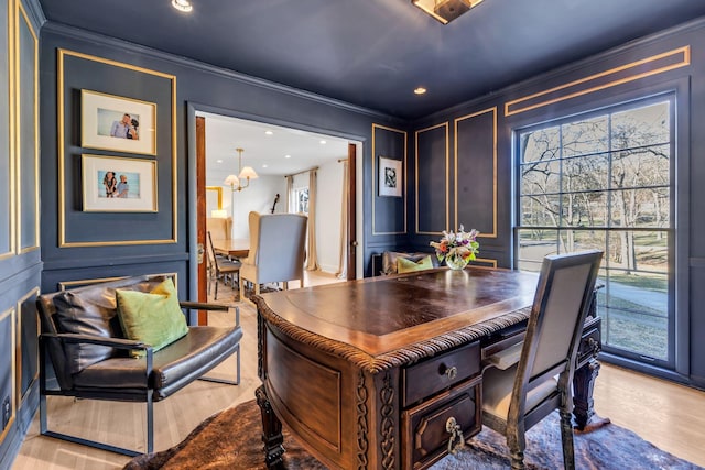 office featuring crown molding and light hardwood / wood-style flooring