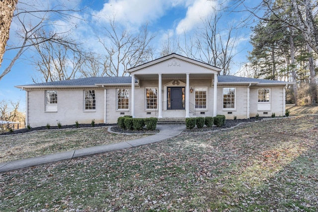 view of front of home featuring a front yard and a porch