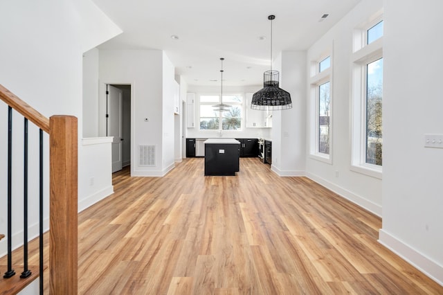 unfurnished living room featuring light wood-type flooring