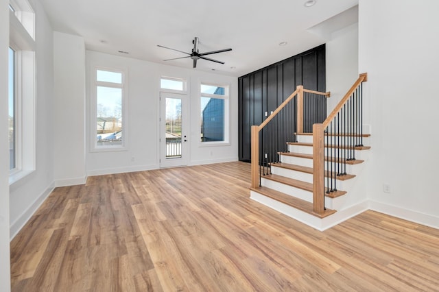 foyer entrance featuring ceiling fan and light hardwood / wood-style floors