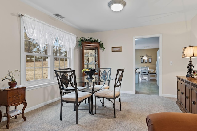 view of carpeted dining room