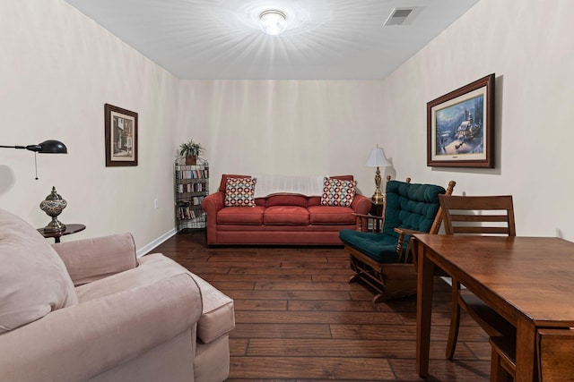 living room with dark hardwood / wood-style floors