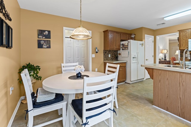 dining space featuring sink