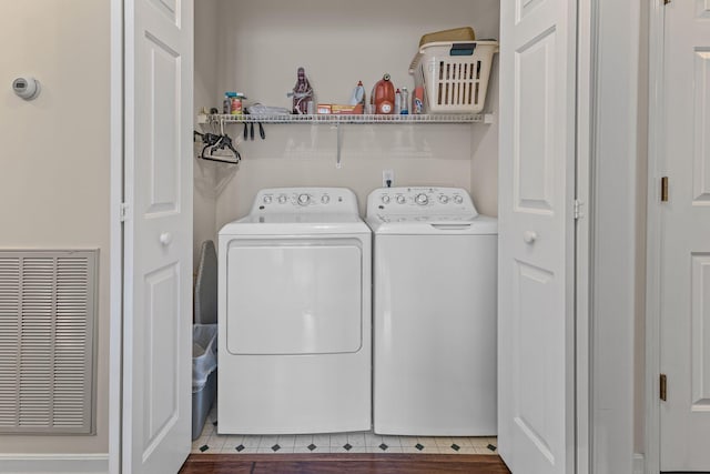 washroom featuring washer and clothes dryer