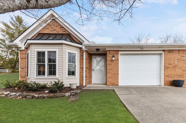 view of front of property with a garage and a front lawn