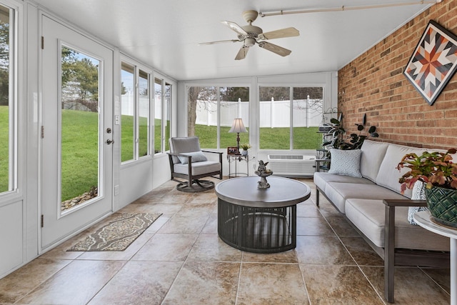 sunroom / solarium with a wall mounted AC and ceiling fan