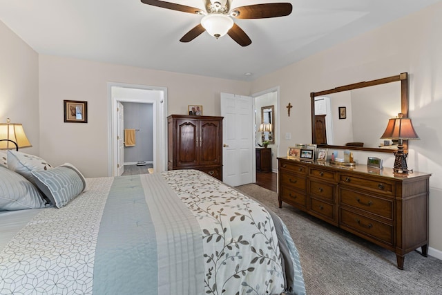 carpeted bedroom featuring ceiling fan and connected bathroom