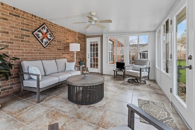 sunroom with ceiling fan