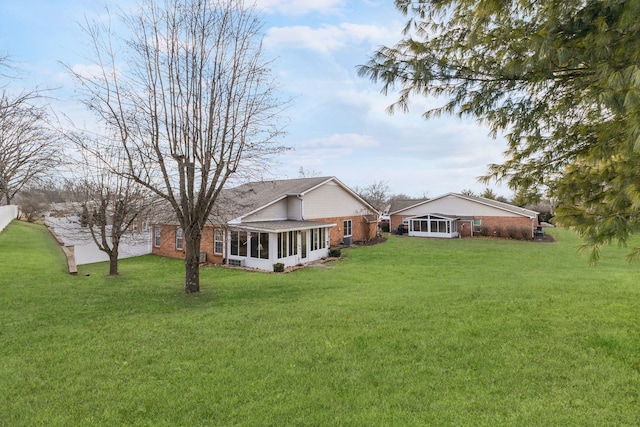 view of yard featuring a sunroom