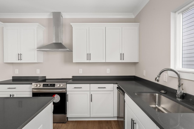 kitchen with white cabinetry, sink, and wall chimney exhaust hood