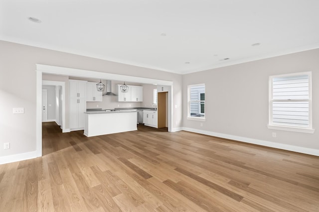 unfurnished living room with light wood-type flooring