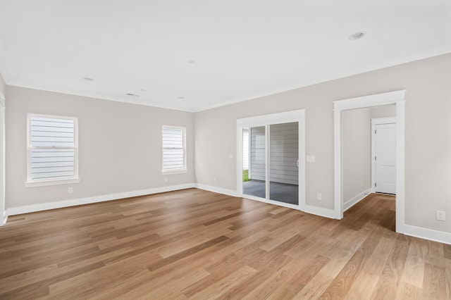 spare room featuring light hardwood / wood-style floors