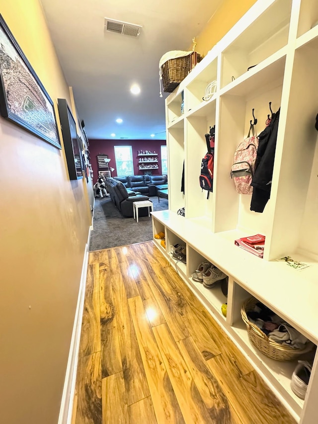 mudroom with hardwood / wood-style flooring