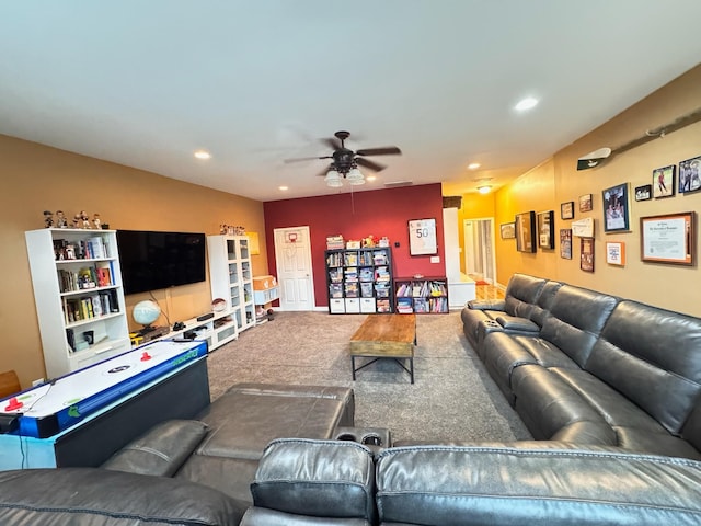 carpeted living room featuring ceiling fan