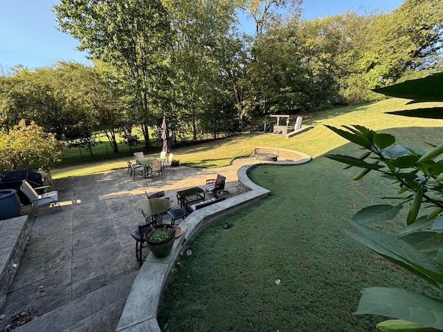 surrounding community featuring a yard and a patio