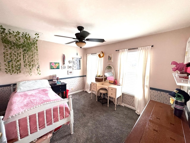 bedroom featuring ceiling fan and dark colored carpet