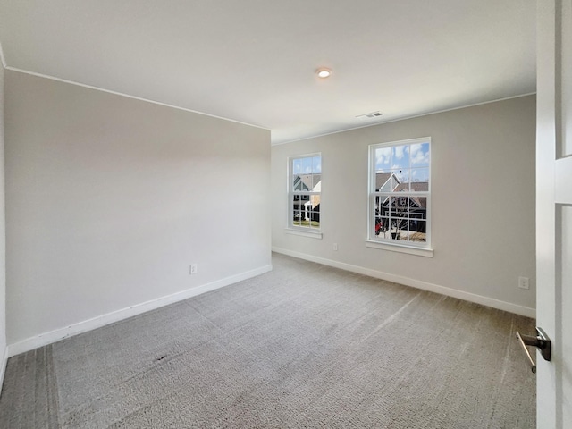 unfurnished room featuring carpet