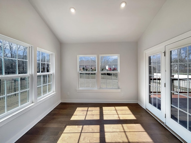 unfurnished sunroom featuring lofted ceiling