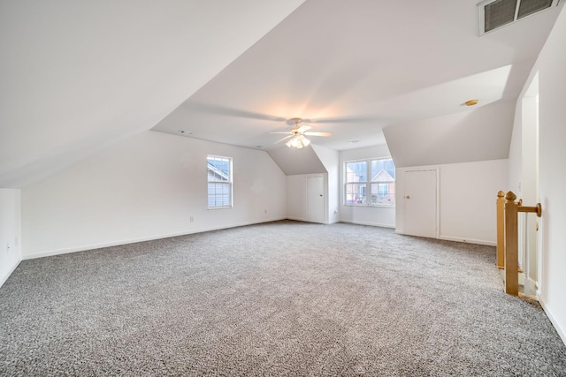 bonus room with carpet floors, ceiling fan, and vaulted ceiling