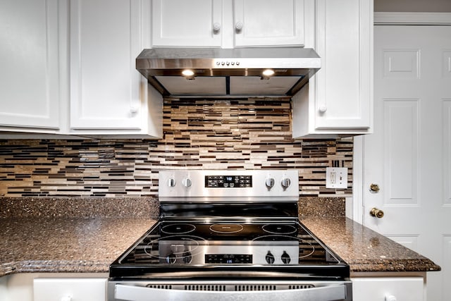 kitchen with decorative backsplash, stainless steel electric stove, white cabinets, and range hood