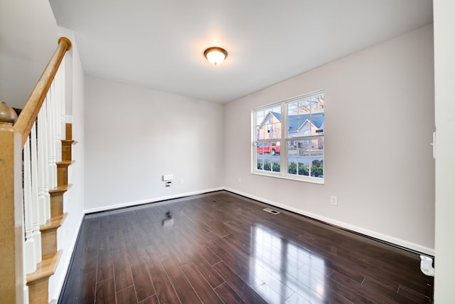 unfurnished room with wood-type flooring