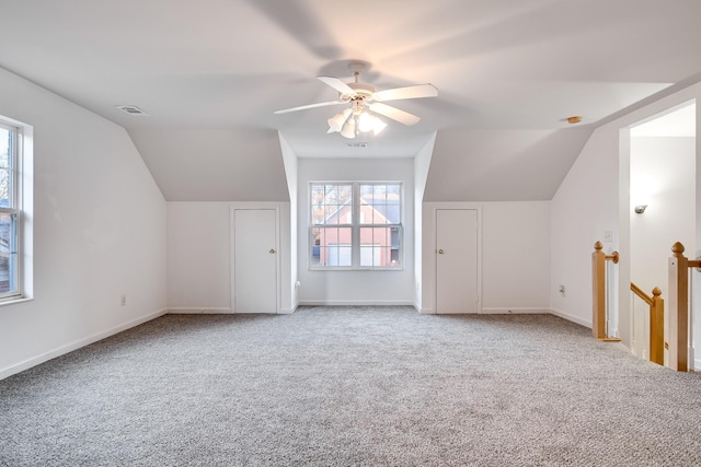 additional living space with vaulted ceiling, ceiling fan, and carpet floors