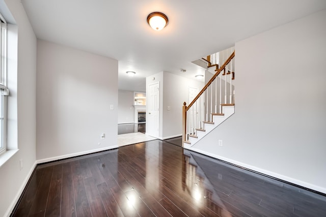 unfurnished living room featuring hardwood / wood-style floors