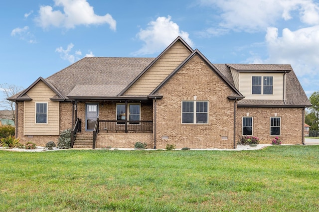 view of front of house featuring covered porch and a front yard