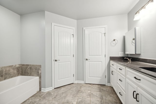 bathroom with vanity and a bathtub