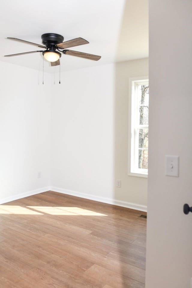 unfurnished room featuring ceiling fan and light hardwood / wood-style floors