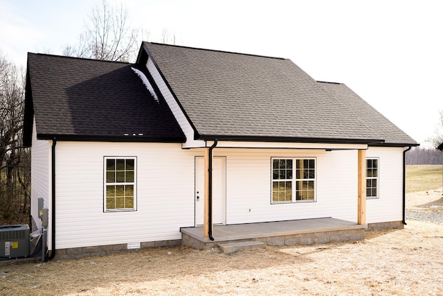 rear view of house with a patio and central air condition unit