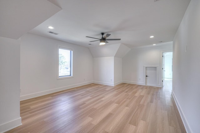 bonus room with vaulted ceiling, ceiling fan, and light wood-type flooring