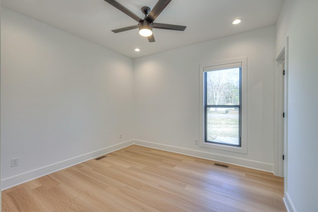 empty room featuring light hardwood / wood-style flooring and ceiling fan