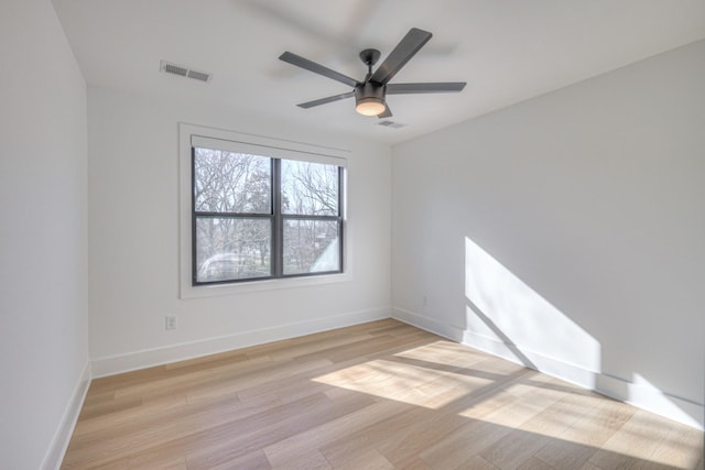 spare room featuring light hardwood / wood-style floors and ceiling fan