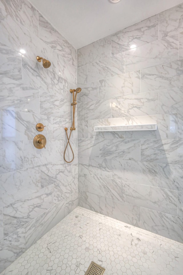 bathroom with tiled shower