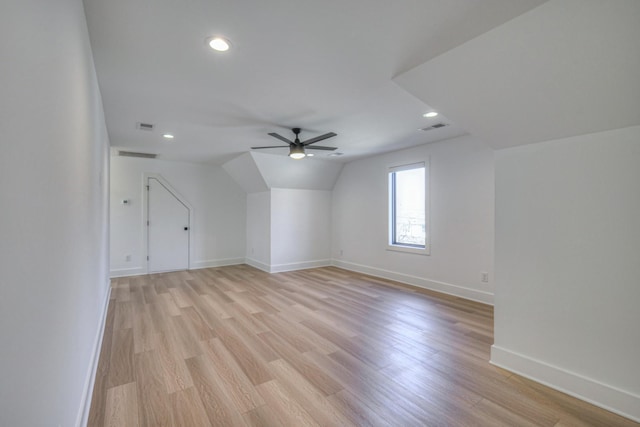 bonus room featuring ceiling fan, vaulted ceiling, and light hardwood / wood-style flooring