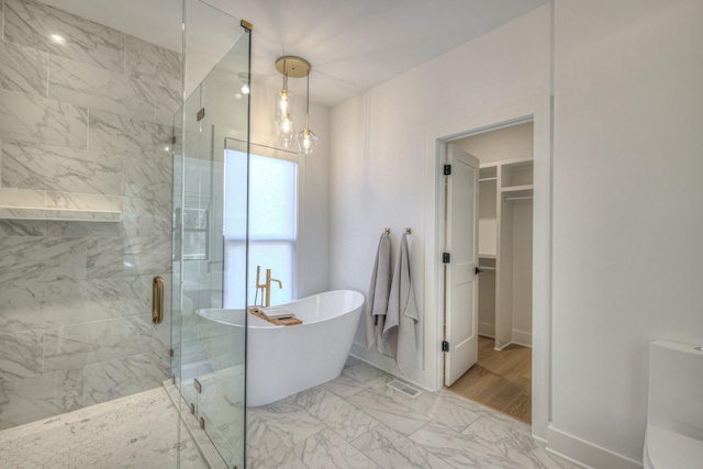 bathroom with shower with separate bathtub