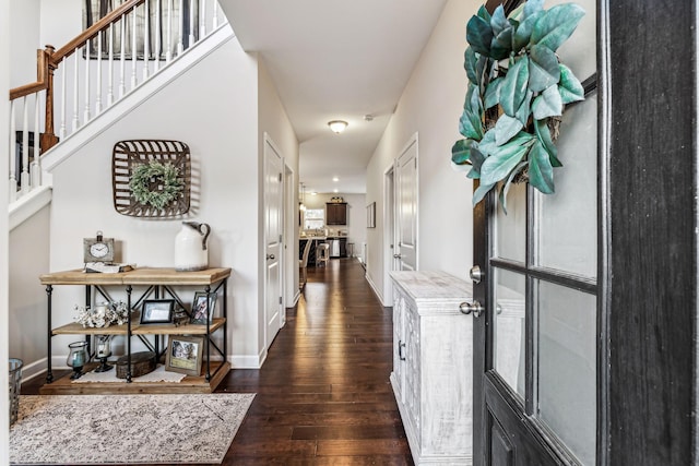 corridor featuring dark hardwood / wood-style floors