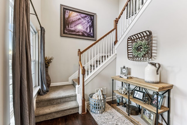 stairway featuring wood-type flooring