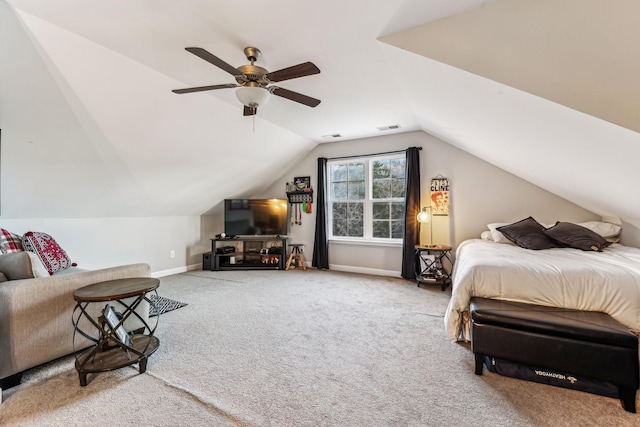 bedroom with vaulted ceiling, ceiling fan, and carpet