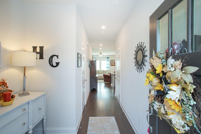 hallway with dark wood-type flooring